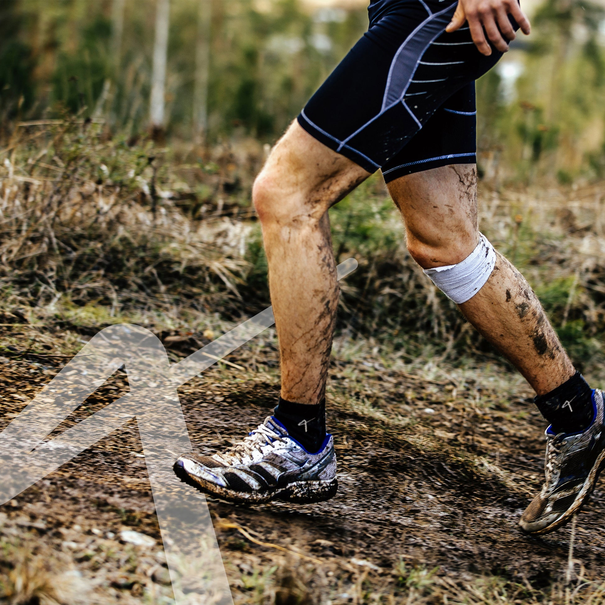 man running in the dirt with Triumphant Sports Specialised Activewear Socks Champion Series Ankle Length Black