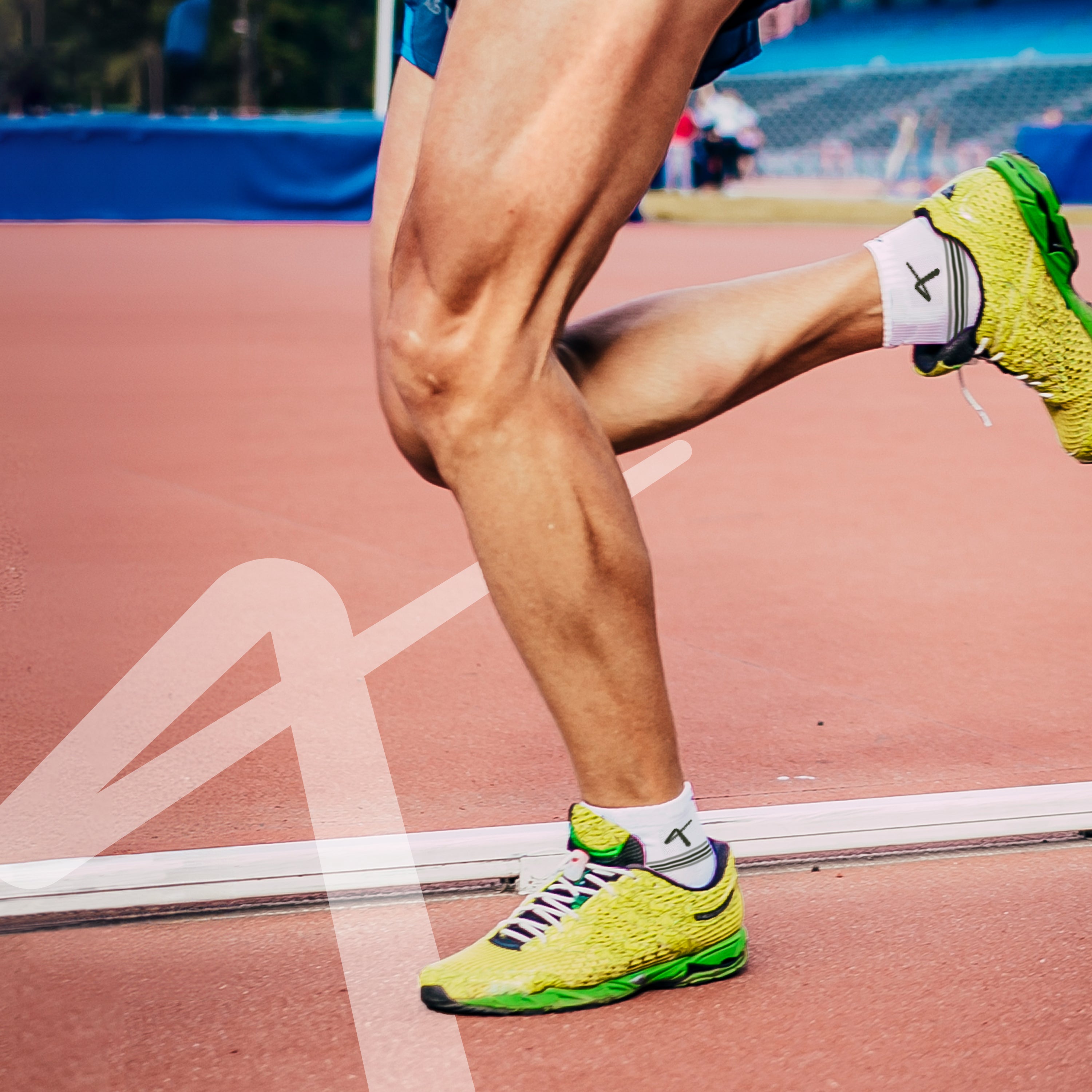 Man running with Triumphant Sports Specialised Activewear Socks Champion Series Ankle Length White Green
