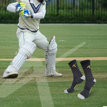 lifestyle photo of the Triumphant sports Champion Series Performance Cricket Socks Crew Length Black Yellow